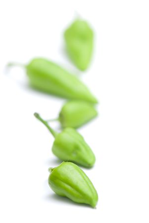 composition from a green pepper on the white isolated backgroundの写真素材