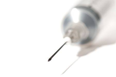 medical syringe with a needle on the white isolated backgroundの写真素材