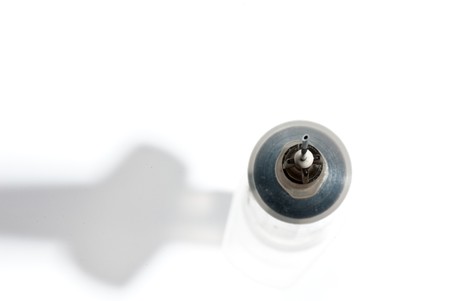 medical syringe with a needle on the white isolated backgroundの写真素材