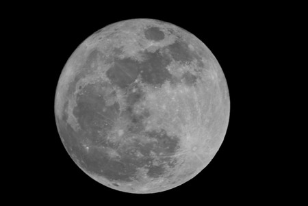Full moon closeup showing the details of the lunar surfaceの写真素材