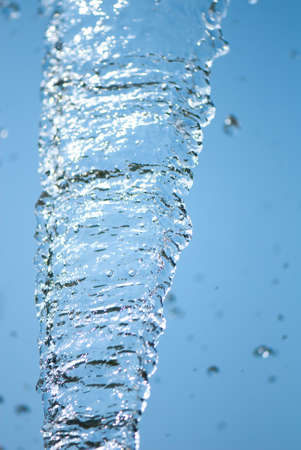 Beautiful splashes of fresh water on a color backgroundの写真素材