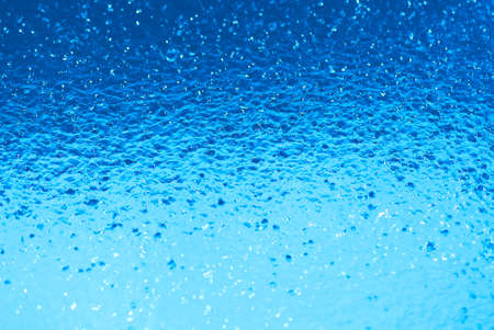 Beautiful splashes of fresh water on a color backgroundの写真素材