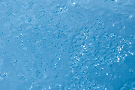 Beautiful splashes of fresh water on a color background