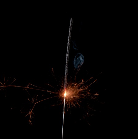 Christmas sparkler isolated on black background. Bengal fire の写真素材