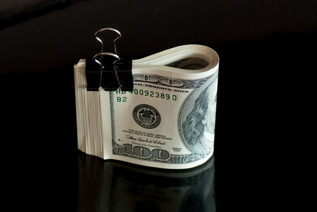 stack of money on white isolated background.  Studio photo.の写真素材