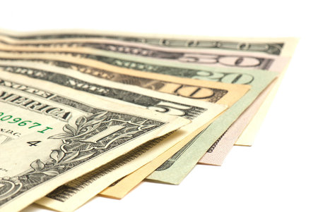 stack of money on white isolated background.  Studio photo.
