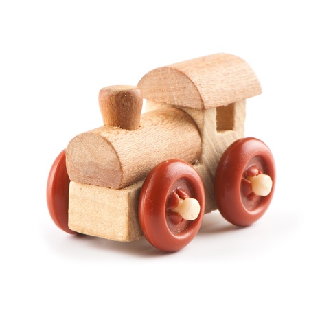 wooden toy train on a light background. Studio photo の写真素材