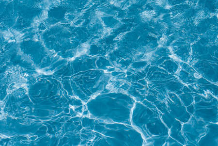 Beautiful splashes of fresh water on a color backgroundの写真素材