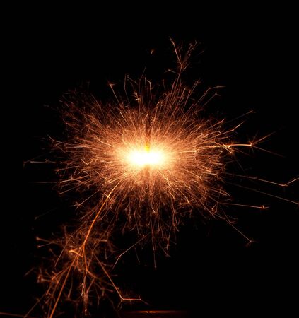 Christmas sparkler isolated on black background. Bengal fire の写真素材