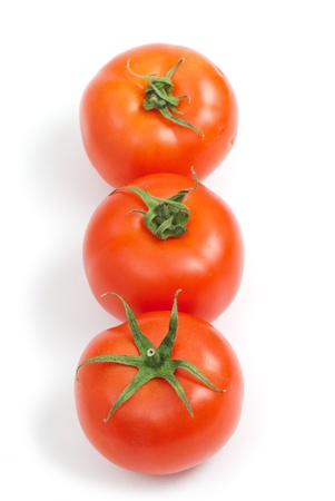 Tomatoes on the white isolated background.  Studio photoの写真素材
