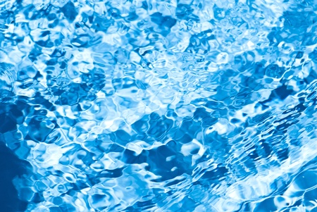 Beautiful splashes of fresh water on a color backgroundの写真素材