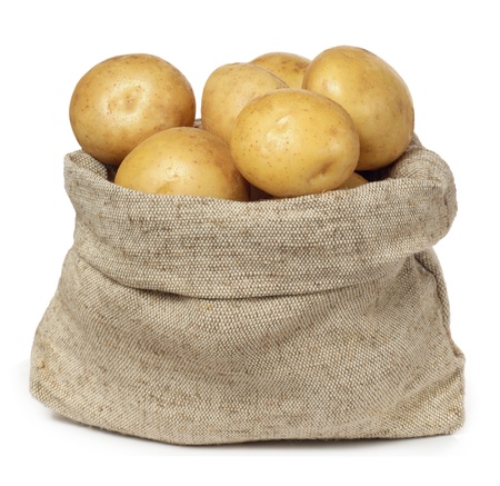 potatoes in burlap sack on white background の写真素材