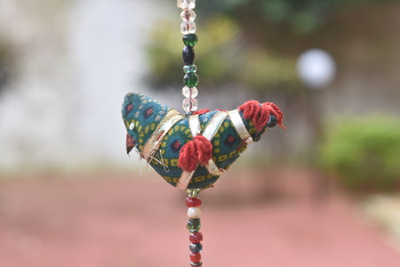 bird toy made of cloths in India used for decorationの写真素材