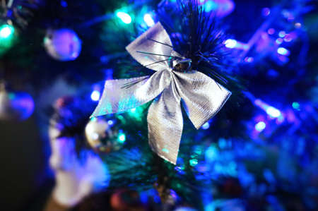 christmas bow on a tree with bright lanterns. holidayの写真素材