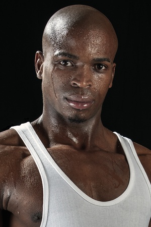 Portrait of young handsome African sportsmanの写真素材