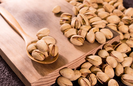 pistachios in wooden board