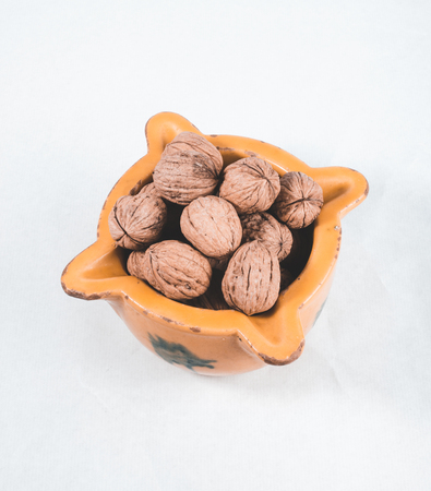 walnuts bowl on white backgroundの写真素材