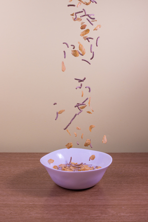 corn and wheat cereals in bowlの写真素材