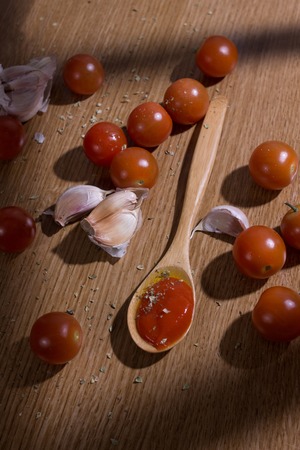 natural tomato sauce on a rustic tableの写真素材