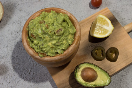 Bowl of guacamole with fresh ingredients