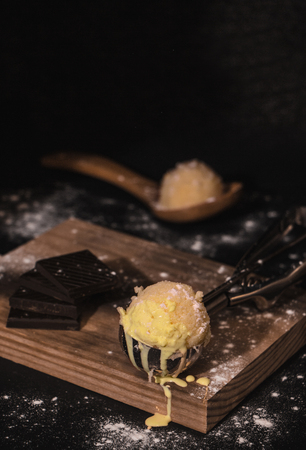 homemade vanilla ice cream with chocolate, on dark backgroundの写真素材