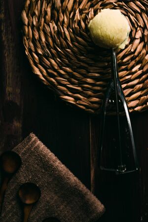 Homemade vanilla ice cream on wooden table with vintage cutleryの写真素材