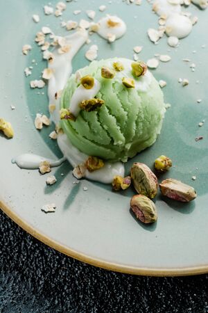 dessert pistachio ice cream, vegan food with coconut milkの写真素材