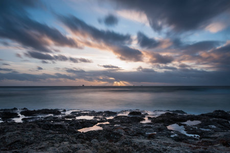 Sunset at the beach with the rooksの写真素材