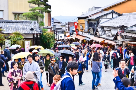 KYOTO, JAPAN - APRIL 13 2013  Tourists wander a famous street, Sannen-Zaka, in Kyoto on April 13 2013  The street is located in the heart of Kyoto attractions  Many souvenir shops can be found here のeditorial素材