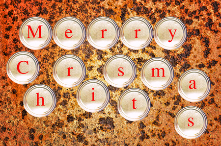 Stacked cans write merry christmas on rusty backgroundの写真素材