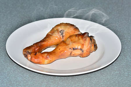 Grilled chicken legs and smokeの写真素材