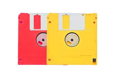 old obsolete colored floppy disks on white background