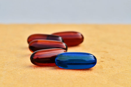 Bright blue capsules in brown capsules