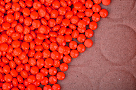 orange pills on paper background
