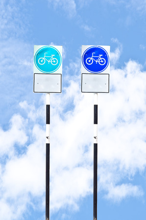 Bicycle sign on blue skyの写真素材