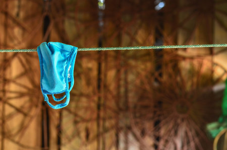 mask hanging on the ropeの写真素材