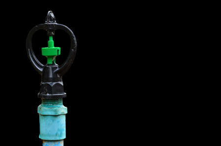 water sprinkler on black backgroundの写真素材
