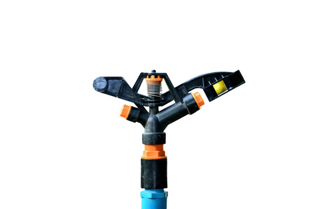 sprinklers watering on white backgroundの写真素材