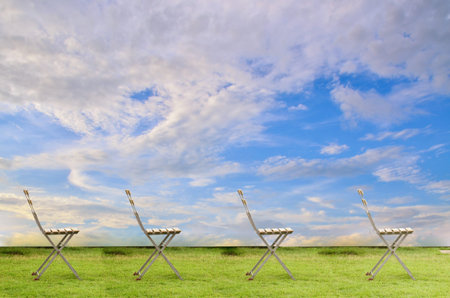 Old chair on blue sky backgroundの写真素材