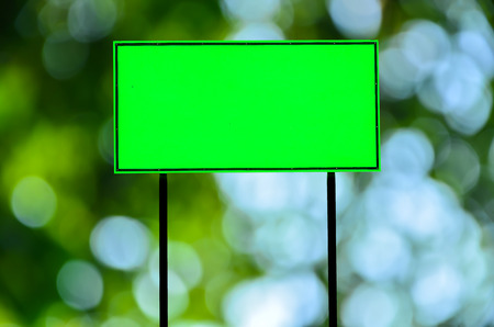 Green traffic road sign on green nature  backgroundの写真素材