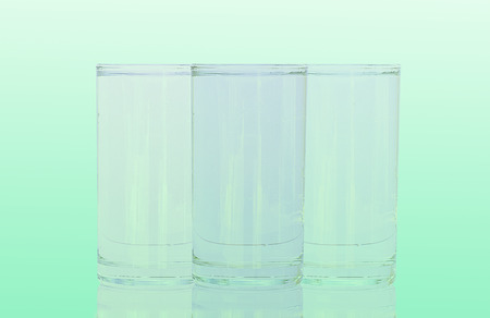 Group Glass of water on green white backgroundの写真素材