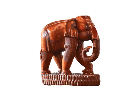 Wooden hand made elephant isolated on whiteの写真素材