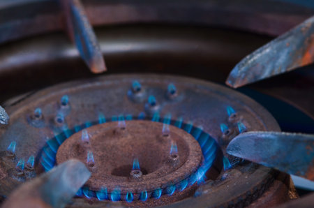 Blue flames on gas stove burner