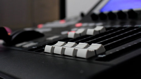 Close up of video mixer control panel at tv broadcasting studio. Selective focus.
