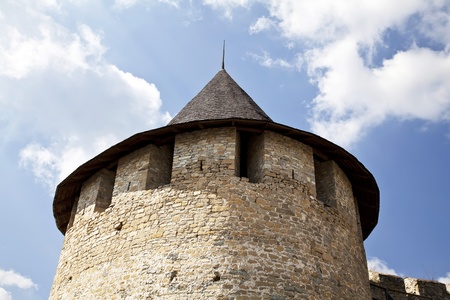 Hotin castle tower with ruins in summer in ukraineの写真素材