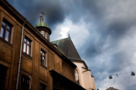 Dramatic dark blue sky over cathedral In Lvov in Ukraineの写真素材