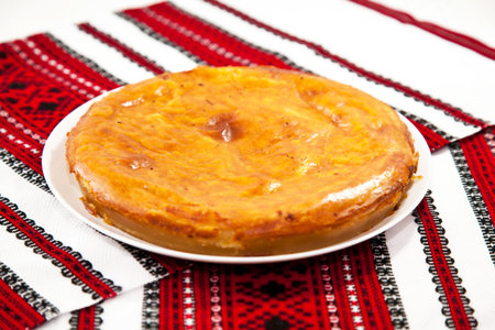Onion and cheese pie on traditional ukrainian towelの写真素材