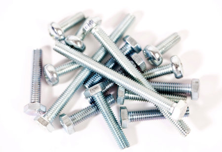 Bolts and hobnails on white background