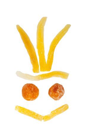 Funny shape made with dried sweet fruits isolated on whiteの写真素材