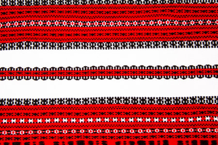 Ukrainian national red and black ornament embroidery closeup